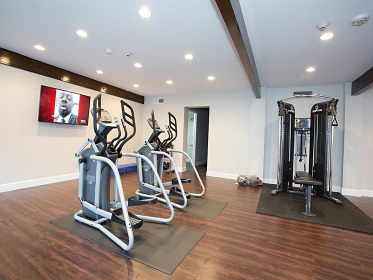 Apartment building onsite fitness center with a variety of equipment at Arcadia Gardens in Phoenix